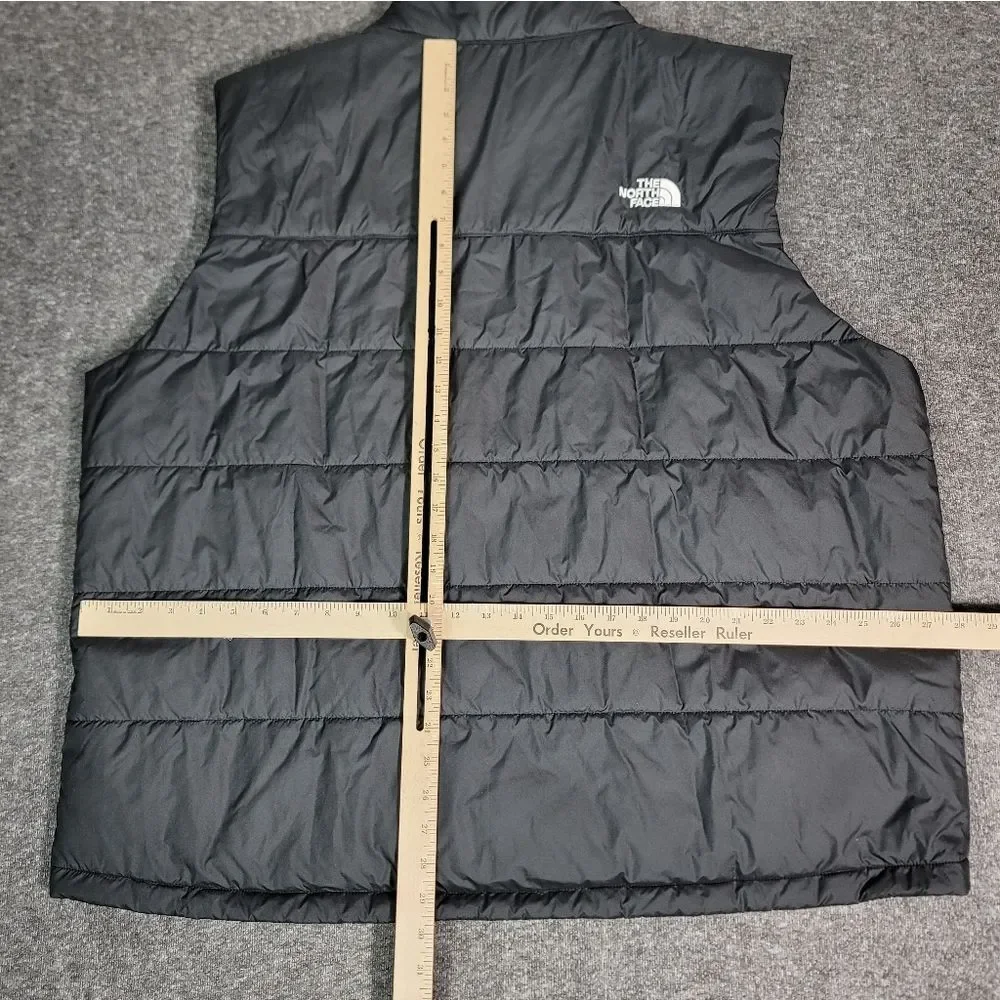 Premium insulated puffer vest by The North Face featuring embroidered Synchrony